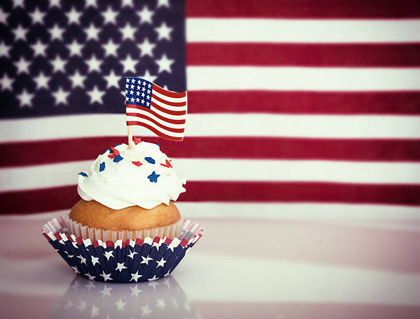 istock Patriotic cupcake with American flag 477413992