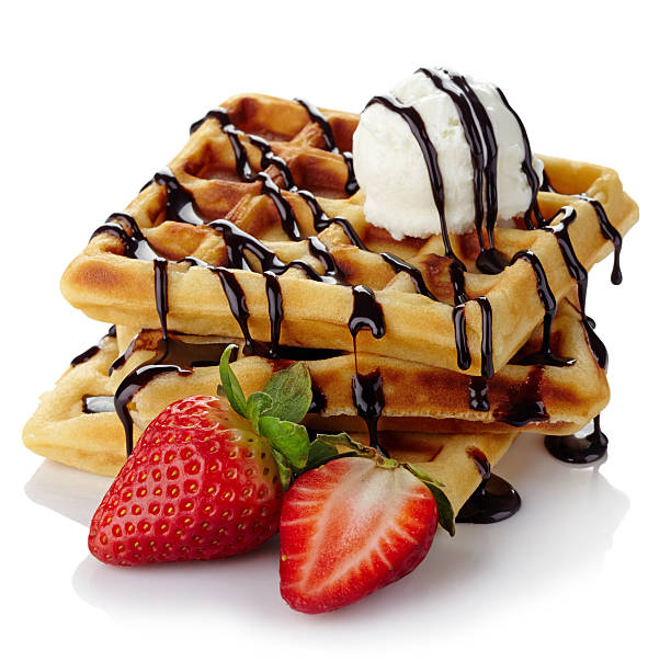 Belgium waffles Belgium waffles with chocolate sauce, ice cream and strwaberries isolated on white background waffle stock pictures, royalty-free photos & images
