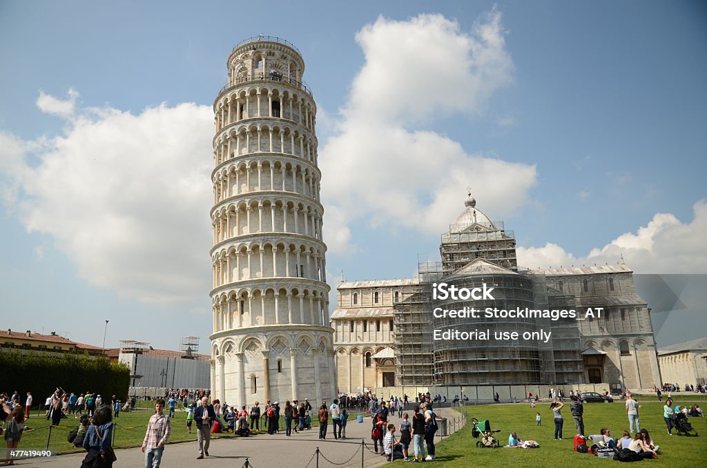 Leaning Tower of Pisa Pisa, Italy - April 14, 2014: Tourists are visiting the place of the world famous Leaning Tower of Pisa.  2015 Stock Photo