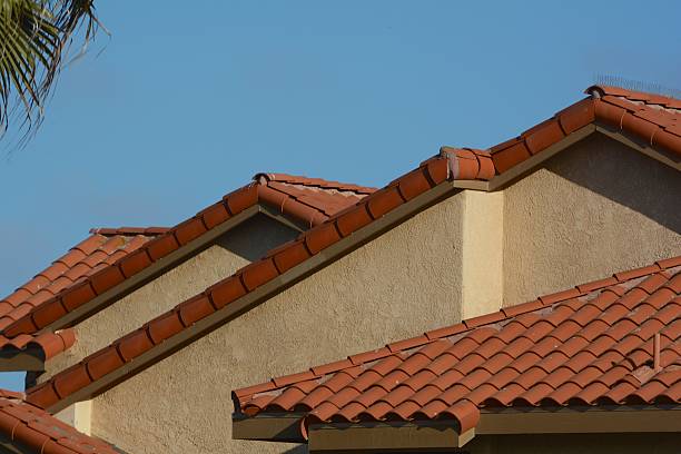 istock Terra Cotta Roofing Tiles Against Blue Sky 477419802