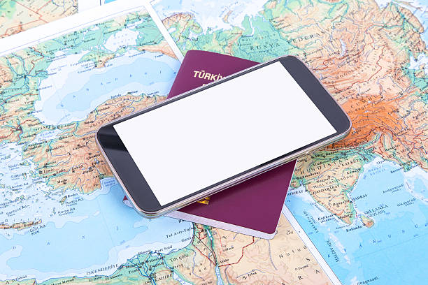 Smartphone and Passport on World Map