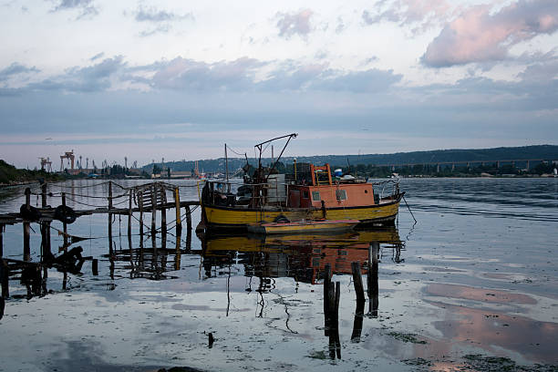 Bursa, Turkey - November 06, 2016: Local fisherman casting net in the Uluabat Lake in Gölyazı-Bursa in Turkey. Fishermen go out for fishing in the sea on early morning.