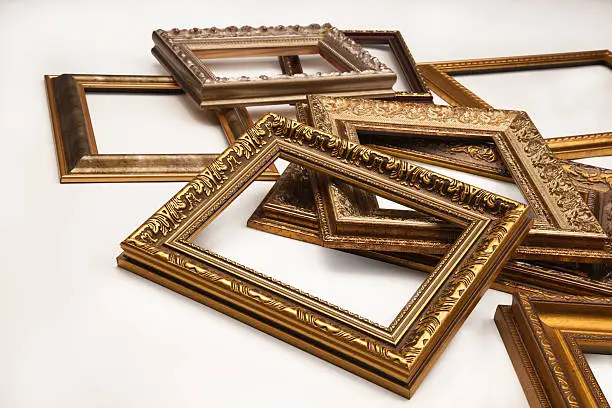 Photo of Stack of vintage frame on white background