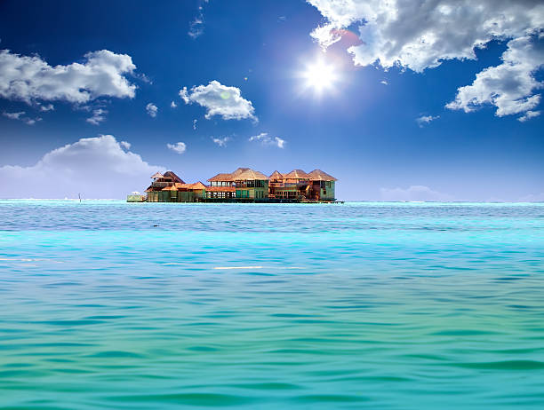 istock Island in ocean, overwater villas 477427430