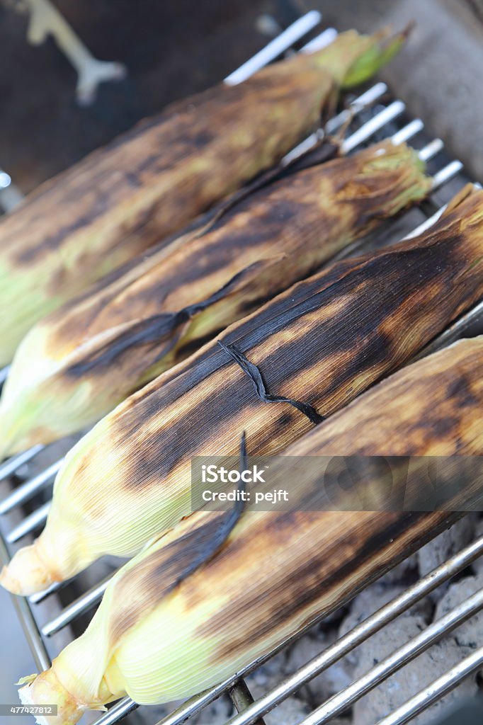 Grilled corn on the cob - maize and barbecue grill Summer is corn maize on grill for dinner. 2015 Stock Photo