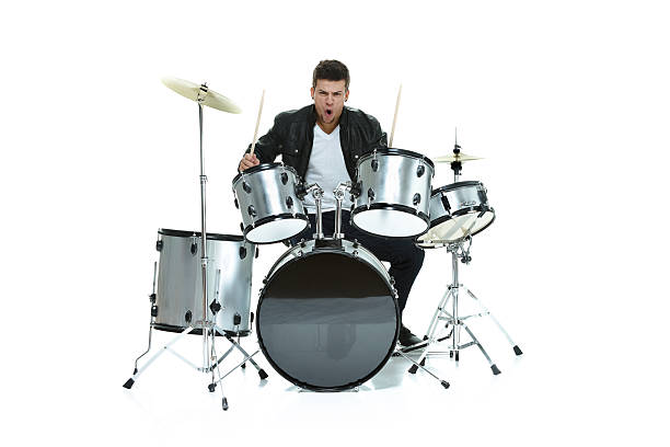 istock Casual excited man playing drums 477428104