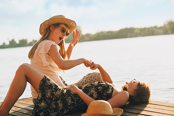 istock friends joking around enjoying the sun 477428688