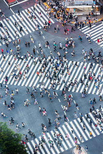 Aerial photograph of people walking across the Shibuya crossing in Tokyo, Japan