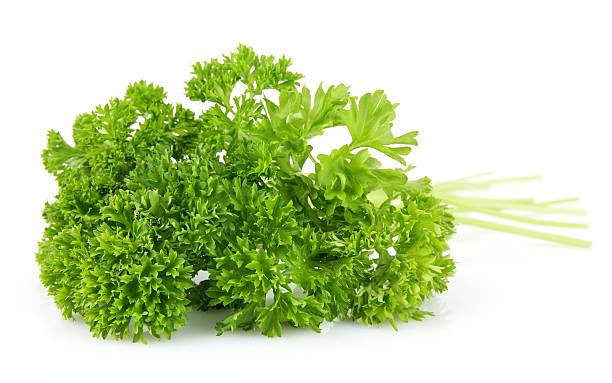 istock Parsley leaves isolated on white background 477428910