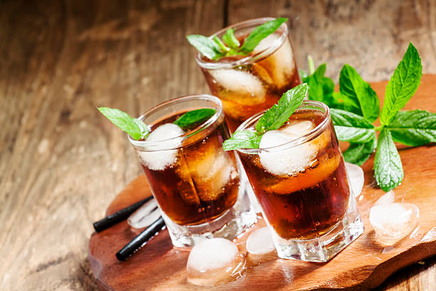 istock Cuba Libre with mint and ice in a glass 477429424