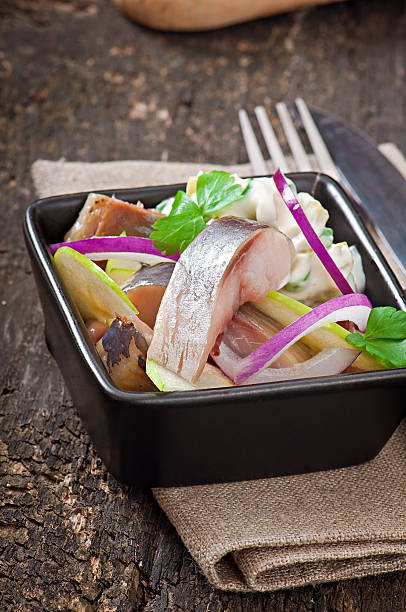 istock Herring salad with onion and green apple 477430411