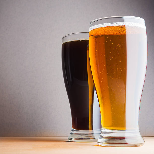 istock Glass of light and dark beer 477430734