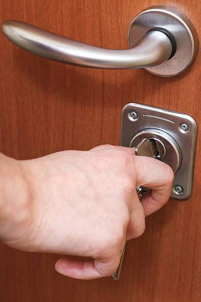 istock closing house door by key 477430737