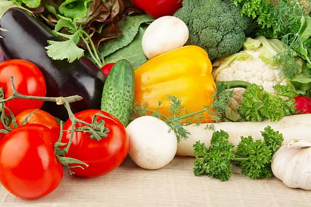 istock Group of different vegetables on wooden board 477430766