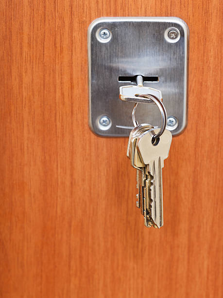 istock keys on ring in keyhole of door 477431225