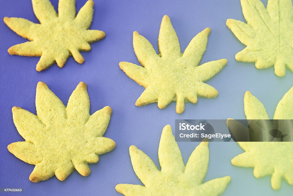 Leaf cookies scattered Marijuana leaf shaped cookies made with marijuana infused butter Alternative Medicine Stock Photo
