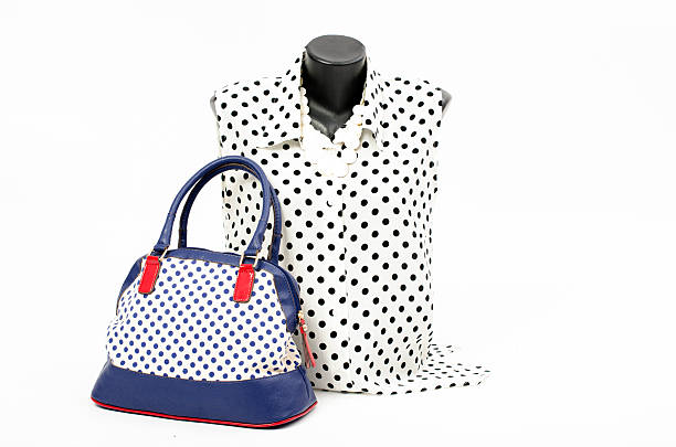 istock Black and white dots blouse on mannequin with matching accessories. 477433648