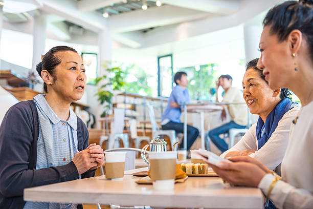 istock Happy senior Japanese women inside a cafe 477434020