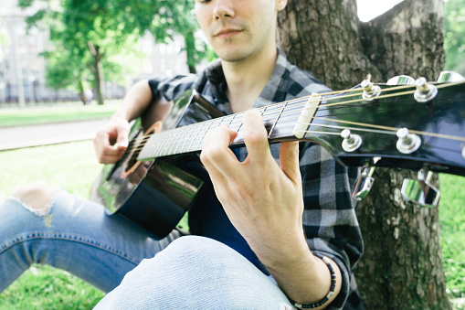 Guitar player at the park.