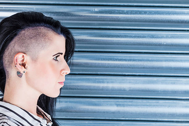 istock Woman With A Part-shaved Head And Tattoos 477434472