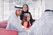 Traditional Arabic family enjoying at lounge