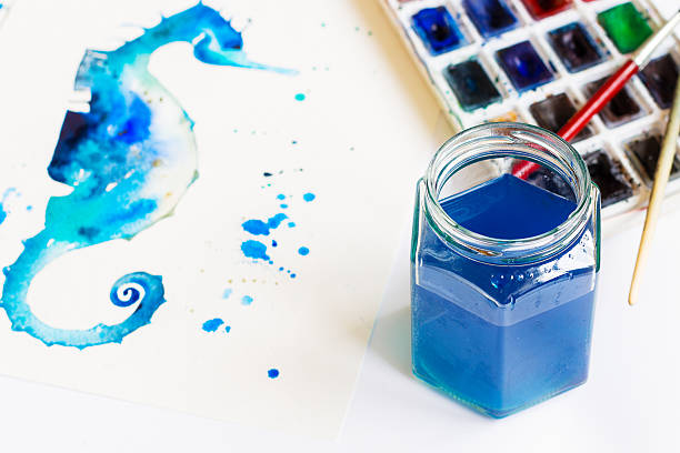 Watercolor jar with a blue tinted water in it