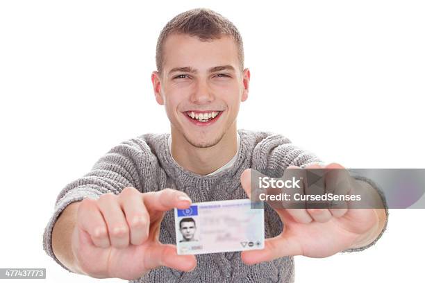 Young Man Showing His Driver License Stock Photo - Download Image Now - Driver's License, Holding, Identity