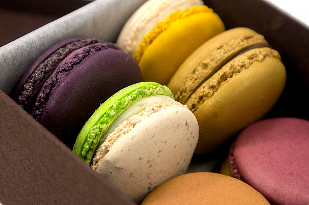 istock Colorful Macaron in paper box on white background 477438113
