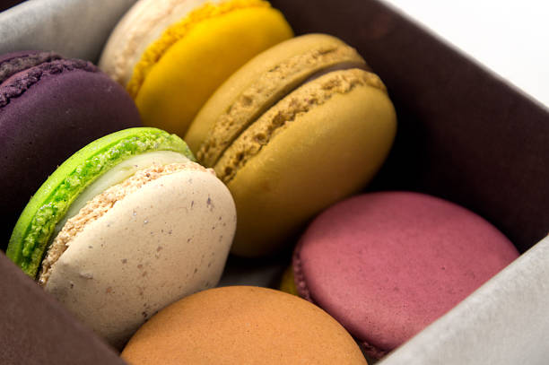 istock Colorful Macaron in paper box on white background 477438115