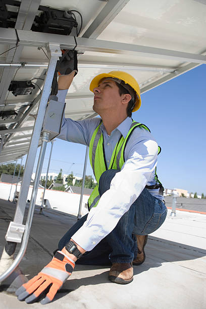 istock Maintenance Worker Installing Solar Photovoltaic Panels 477438785