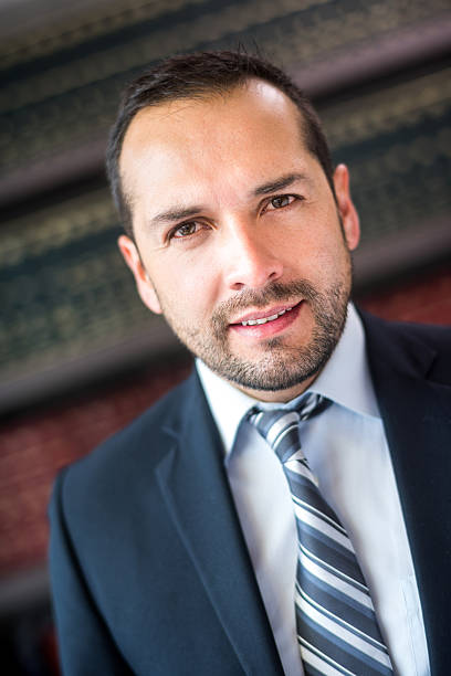 Elegant Latin American lawyer or business man at the office