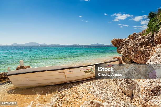 Destoyed Fishing Boat At Rocks Under Bright Sunlight Stock Photo - Download Image Now