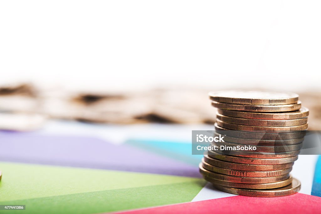 Diagram and coins Diagram and coins on background 2015 Stock Photo