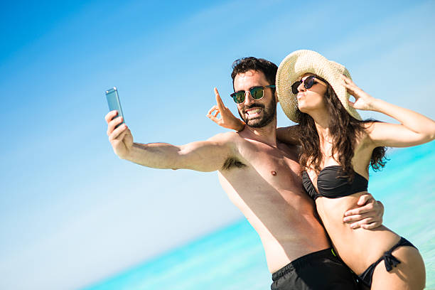 istock Happiness couple at the seaside take a selfie 477442280