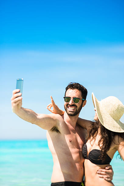 istock Happiness couple at the seaside take a selfie 477442284