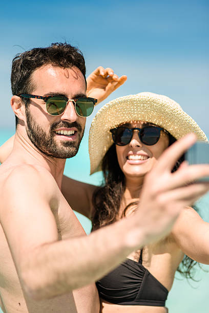 istock Happiness couple at the seaside take a selfie 477442286