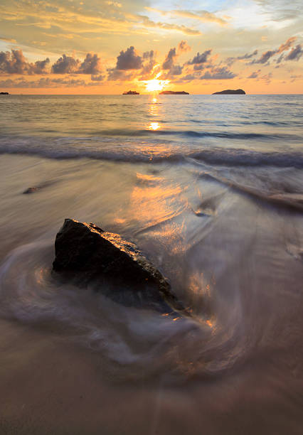 istock Dramatic waves at sunset in Sabah, Borneo, Malaysia 477445595
