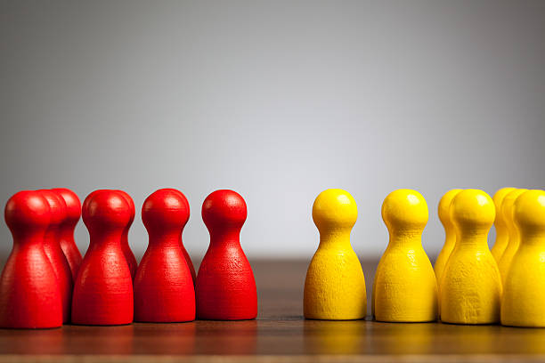 istock Opposition groups concept, toy pawn figures 477446347