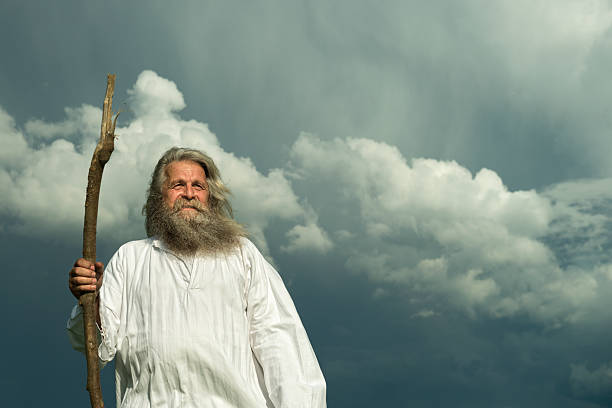 istock long-haired prophet standing in front of dramatic sky 477446440