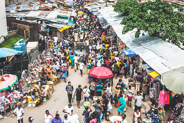 Downtown market streets. Lagos, Nigeria. Street market crowd at Lagos Island's commercial district. nigeria stock pictures, royalty-free photos & images