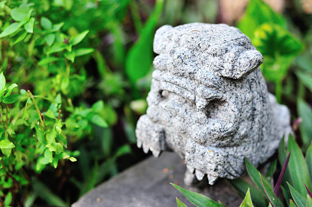 istock Lion statue in nature place soft light 477449900