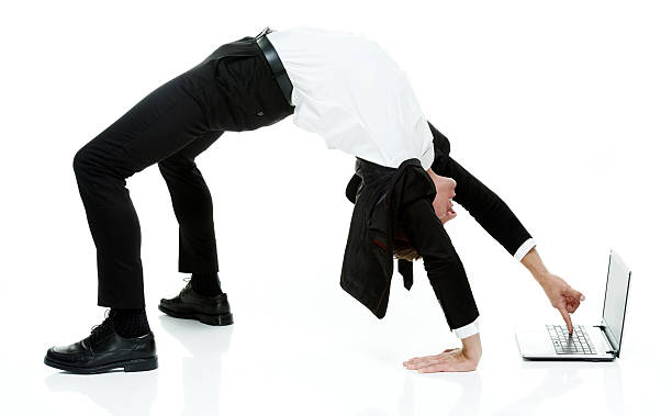 istock Businessman using laptop in yoga posture 477450088
