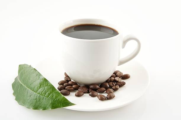 istock Cup of coffee with saucer with leaf on white 477450126