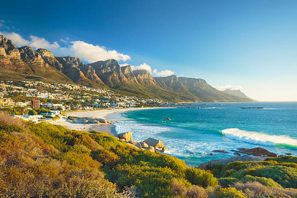Twelve Apostles mountain in Camps Bay, Cape Town, South Africa Beach and Twelve Apostles mountain in Camps Bay near Cape Town in South Africa. african coast stock pictures, royalty-free photos & images