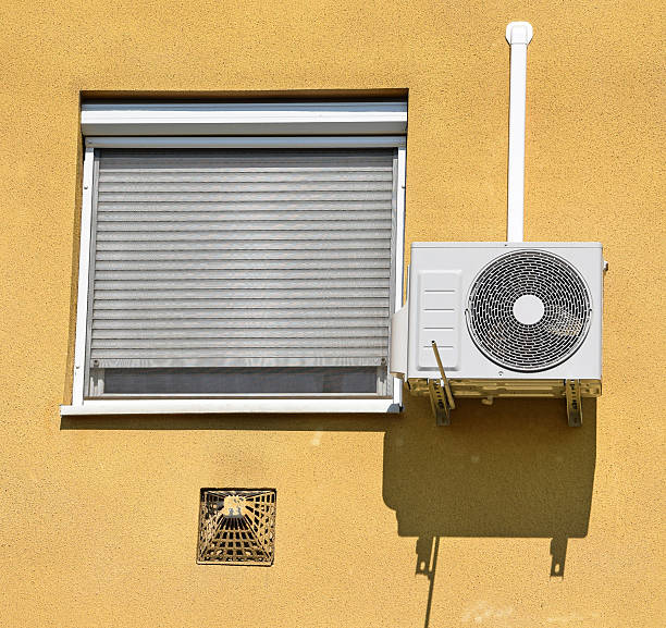 istock Air conditioner on the wall next to a window 477454734