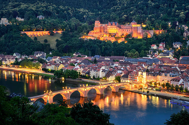 Heidelberg, Germany, at blue hour The city of Heidelberg, Germany, with its famous landmarks, the illuminated historic castle and the Old Bridge on Neckar river, shot at dusk heidelberg germany photos stock pictures, royalty-free photos & images