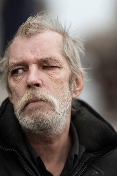 istock portrait of real hobo with tear 477459727