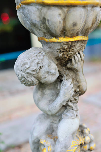 istock Angel statue in nature place in soft light 477459730