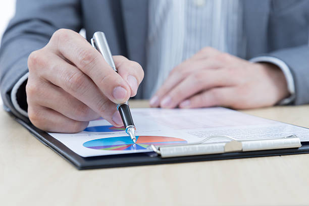 istock Businessman's hand showing financial report 477459821