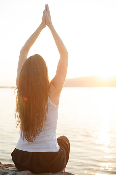 istock Relaxation on the water outdoors, woman with hands up 477463378